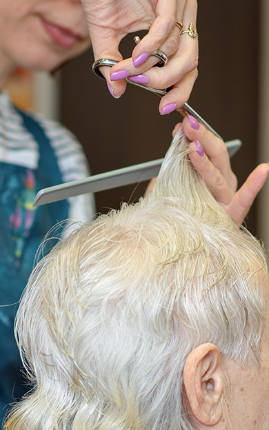 older lady getting haircut