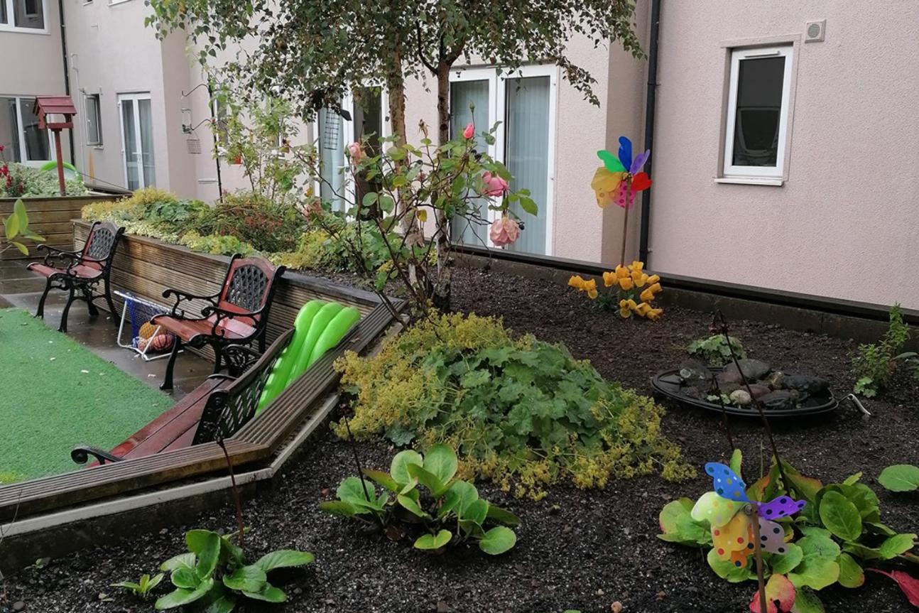 garden with benches and raised planters