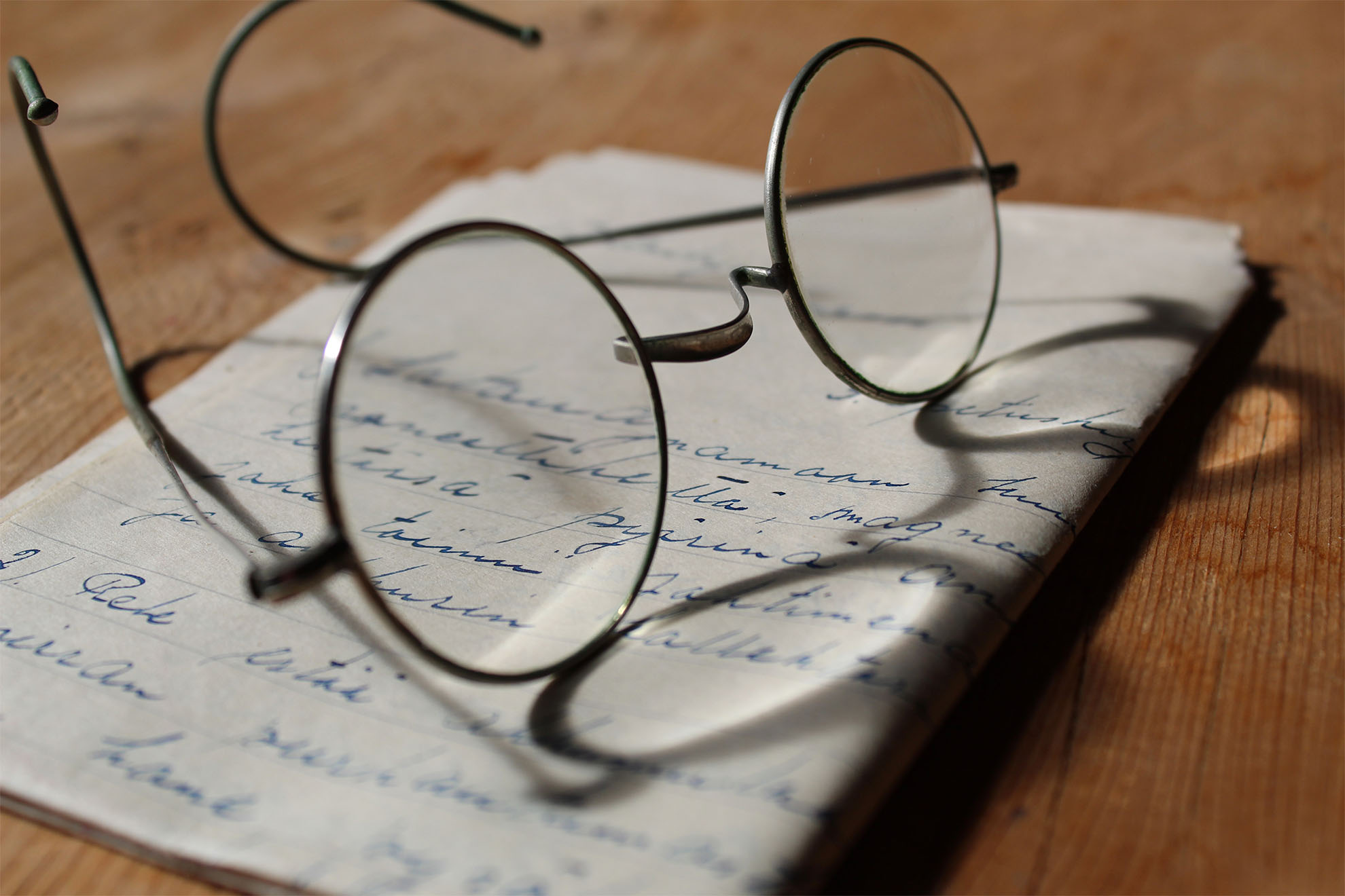 glasses and handwritten paper