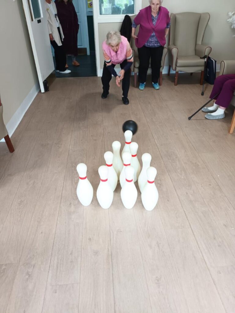 resident playing indoor bowling