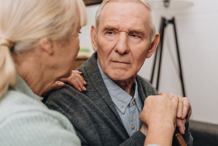 elderly man looking at a woman