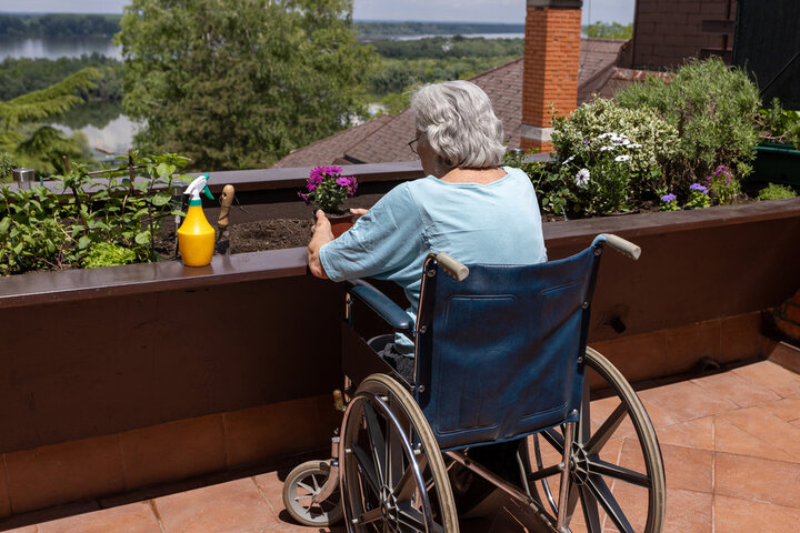 old woman gardening in a wheelchair