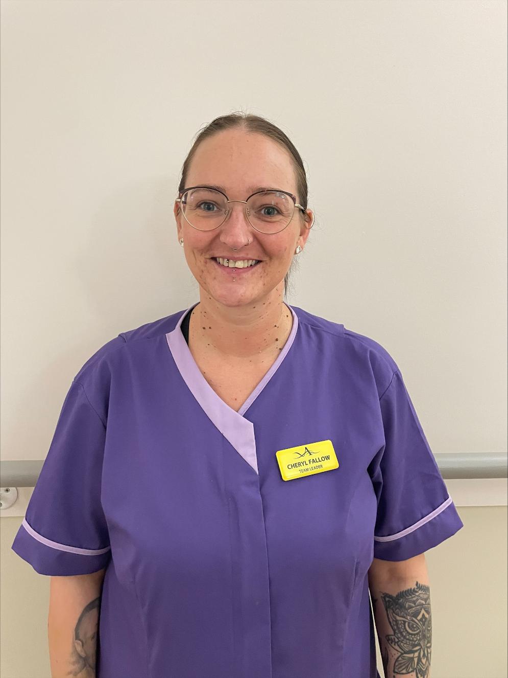 lady smiling at camera for staff photo